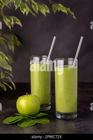 Food photography of smoothie, breakfast, apple, spinach, drink, juice, beverage, energy, detox, green, rustic, spring, straw, raw, refreshing Stock Photo