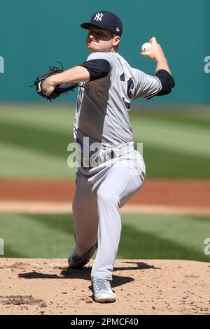 CLEVELAND, OH - APRIL 12: New York Yankees shortstop Anthony Volpe (11)  makes the catch for an out during the eighth inning of the the Major League  Baseball game between the New