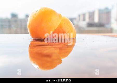 Close-up of a Mirabelle plum, a small yellow plum that is sweet in its taste and tropical as well as exotic. Stock Photo