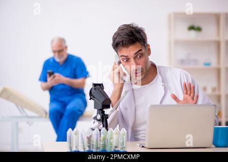 Two chemists in drugs synthesis concept Stock Photo