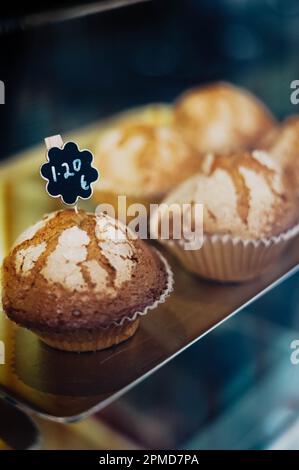 Freshly baked donuts in the shop window. Selective focus. Stock Photo