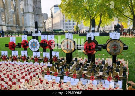 Crosses and poppies in the Field of Remembrance at Westminster Abbey, London, England, UK.  In memory of Coldstream Guards plot. Stock Photo