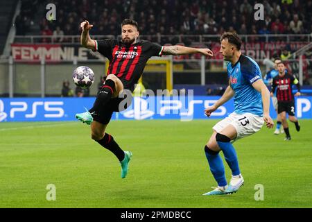 Olivier Giroud (AC Milan) and Amir Rrahmani (SSC Napoli) during the UEFA Champions League, Quarter-finals, 1st leg football match between AC Milan and SSC Napoli on April 12, 2023 at San Siro stadium in Milan, Italy - Photo Luca Rossini / E-Mage Stock Photo