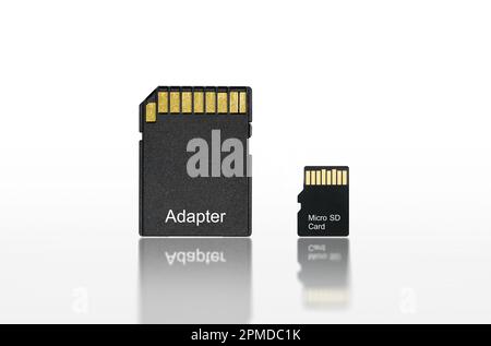 Close up back of micro sd or memory card and adapter isolated on white background with reflection included clipping path, electronic equipment concept Stock Photo