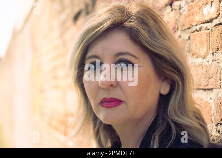 Pensive thoughtful middle aged woman looking away. Stock Photo