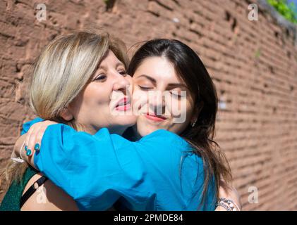 Mother and daughter hugging and expressing affection. Mother's day concept Stock Photo