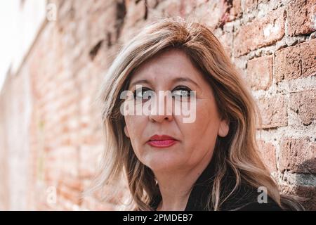 Pensive thoughtful middle aged woman looking away. Stock Photo