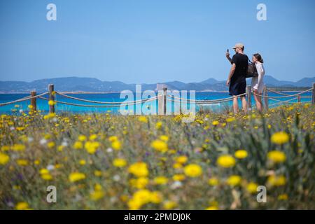 Madrid, Spain. 11th Apr, 2023. People take photos at the seaside in Formentera Island of the Balearic Islands, Spain, April 11, 2023. Credit: Meng Dingbo/Xinhua/Alamy Live News Stock Photo