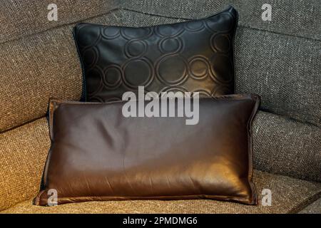 Decorative leather material pillows on the corner of sofa furniture Stock Photo