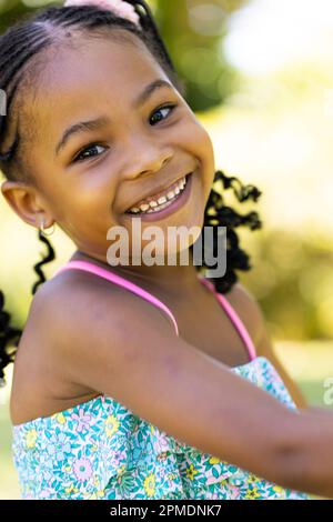 Closeup portrait of cute african american smiling girl looking at camera Stock Photo