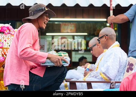 Pai,Northern Thailand-April 4th 2023:Celebrating the moment when boys and adolecents between seven and fourteen are ordained as Buddhist Monks,two eld Stock Photo