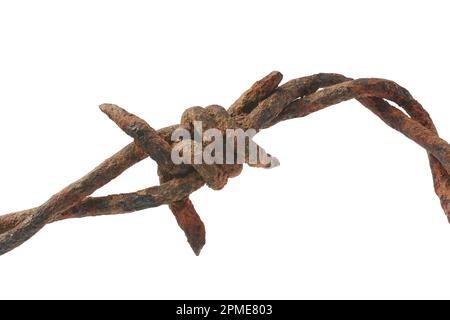 close-up of old rusty barbed wire, dirty, grunge and weathered security wire fence of twisted strands with sharp barbs or points isolated on white bac Stock Photo