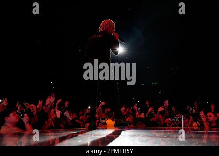 Atlanta Rapper SoFaygo perform on stage at Scotiabank Arena in Toronto with pink hair, a diamond watch, jewel medallion and a Mickey Mouse neck tattoo Stock Photo