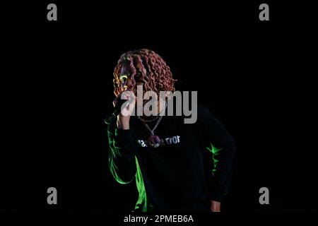 Atlanta Rapper SoFaygo perform on stage at Scotiabank Arena in Toronto with pink hair, a diamond watch, jewel medallion and a Mickey Mouse neck tattoo Stock Photo