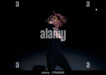 Atlanta Rapper SoFaygo perform on stage at Scotiabank Arena in Toronto with pink hair, a diamond watch, jewel medallion and a Mickey Mouse neck tattoo Stock Photo