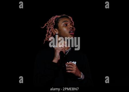 Atlanta Rapper SoFaygo perform on stage at Scotiabank Arena in Toronto with pink hair, a diamond watch, jewel medallion and a Mickey Mouse neck tattoo Stock Photo