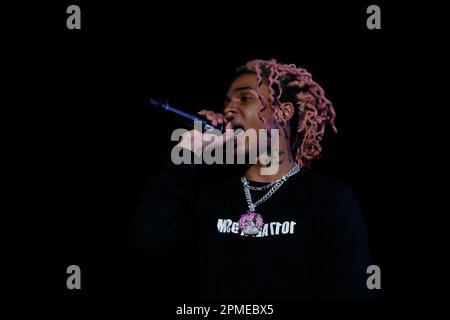 Atlanta Rapper SoFaygo perform on stage at Scotiabank Arena in Toronto with pink hair, a diamond watch, jewel medallion and a Mickey Mouse neck tattoo Stock Photo