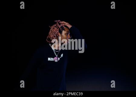 Atlanta Rapper SoFaygo perform on stage at Scotiabank Arena in Toronto with pink hair, a diamond watch, jewel medallion and a Mickey Mouse neck tattoo Stock Photo