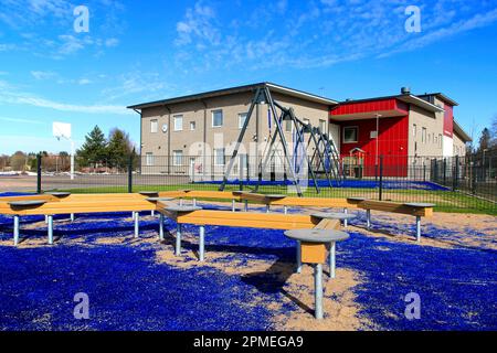 The modern Kirkonkylän koulu primary school and sports yard for children's fitness and leisure activities. Perniö, Salo, Finland. April 9, 2023. Stock Photo