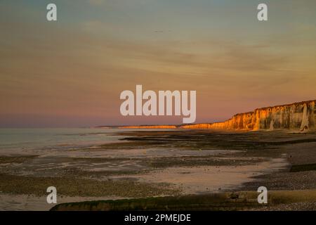 Beach, sunset, chalk cliffs at St. Valery en Caux in Normandy, France. Stock Photo