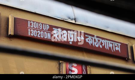 Indian Train Sign Board Written in Bengali. Train from Howrah to Kathgodam. Stock Photo