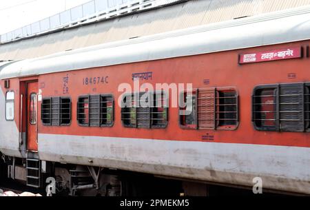 Train Standing at a Station. Modern Red Coloured Indian Train at Howrah Station Platform. Beautiful Red New Train. Stock Photo