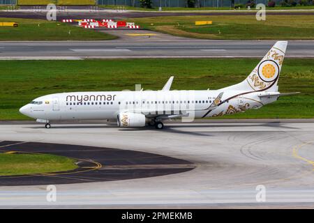 Changi, Singapore - February 3, 2023: Myanmar National Airlines Boeing 737-800 airplane at Changi Airport (SIN) in Singapore. Stock Photo