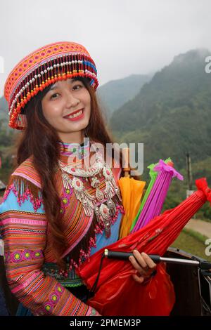 Vietnam, Bac Ha Market, Flower Hmong women in traditional dress The Hmong people are an indigenous group in East and Southeast Asia. In China, the Hmo Stock Photo