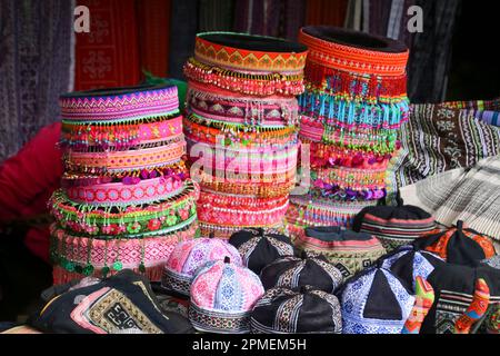 Vietnam, Bac Ha Market, Flower Hmong women in traditional dress The Hmong people are an indigenous group in East and Southeast Asia. In China, the Hmo Stock Photo
