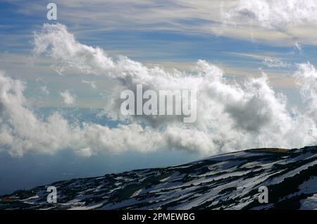 above dramatic clouds in the sky from Etna National Park, Sicily, Italy Stock Photo