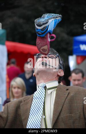 Street entertainer Maynard flip flap performing at the Levens Hall Chilli Festival in 2010 Stock Photo