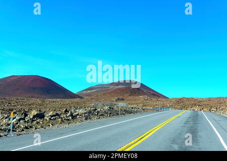 Landscape of Mauna Kea road, winding through the scenic terrain of Hawaii's highest volcano. Stock Photo