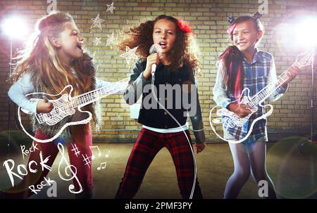 Rockstars in the making. children singing and playing rock music on imaginary instruments. Stock Photo