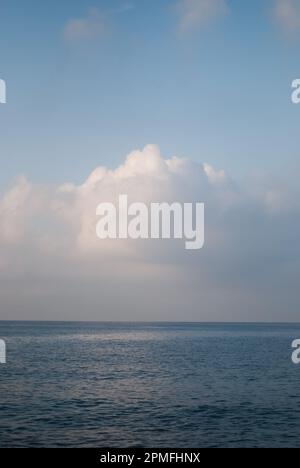 View on white clouds over sea in calm weather Stock Photo