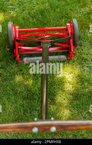 full view of a reel lawnmower after the restoration process was completed Stock Photo