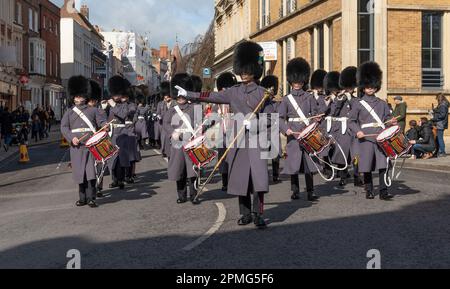 Windsor, Berkshire, England, UK. 2023. Guardsmen marching back to barracks in the town centre  of Windsor following a changing of the guard ceremony. Stock Photo