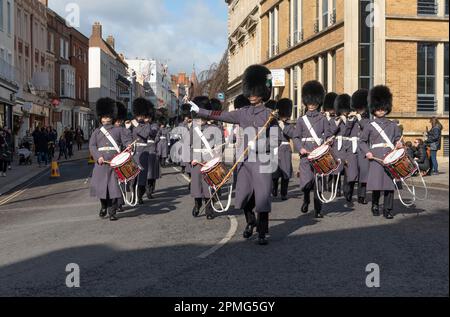 Windsor, Berkshire, England, UK. 2023. Guardsmen marching back to barracks in the town centre  of Windsor following a changing of the guard ceremony. Stock Photo