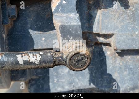 Detail of old tractor and clutch mechanism on side of engine with grease zerk Stock Photo