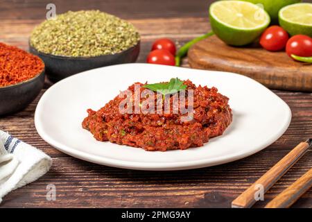 Hot chili peppers harissa sauce. red chili paste or adjika Stock Photo