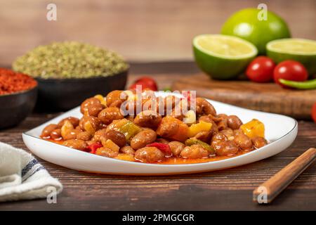 Kidney beans dish with olive oil on wood floor. Healthy foods. Aegean cuisine delicacies. Stock Photo