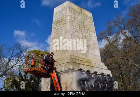 London, UK. 13th April 2023. A worker steam-cleans the Guards Memorial at Horse Guards Parade as preparations for the coronation of King Charles III, which takes place on May 6th, continue around London. Credit: Vuk Valcic/Alamy Live News Stock Photo