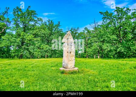 Pagan Slavic Idol with images of ancient Gods, Sofiyivka Park arboretum, Uman, Ukraine Stock Photo