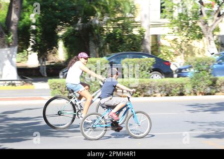 MERIDA, MEXICO - OCTOBER 30, 2016 Sunday cycling on the  Paseo de Montejo - brother and sister Stock Photo