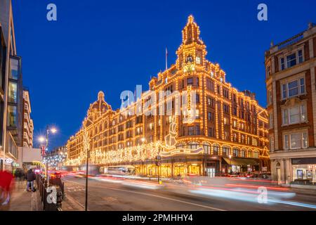 View of Harrods department store illuminated at dusk, Knightsbridge, London, England, United Kingdom, Europe Stock Photo