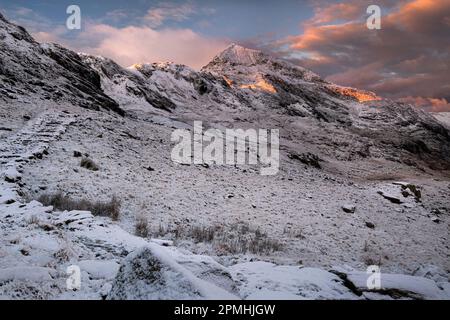 First Light on Crib Goch from the PYG Track in winter, near Pen y pass, Snowdonia National Park, Eryri, North Wales, United Kingdom, Europe Stock Photo