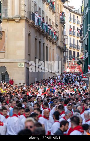 Pamplona, SPAIN: June 07 2022: Thousands of people gathered on the streets of Pamplona waiting for the release of the bulls. First day of 'Encierro' Stock Photo