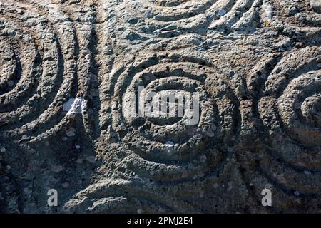Decorated stone block at the entrance to the burial chamber, Neolithic barrow, Newgrange, County Meath, Ireland, passage grave Stock Photo