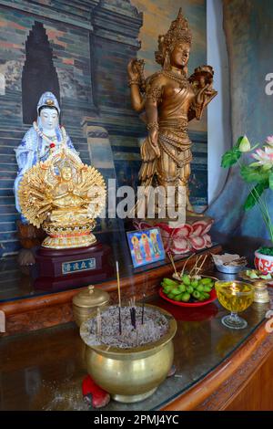 Buddha statue on an altar in a prayer room of the Buddhist monastery Brahma Vihara, Banjar, North Bali, Bali, Indonesia Stock Photo