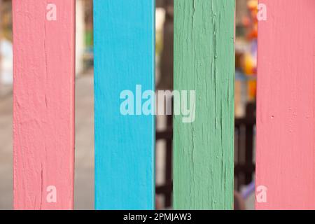 wooden multi-colored fence as background Stock Photo