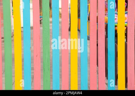 wooden multi-colored fence as background Stock Photo